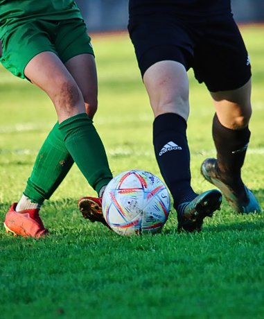 Amateur football players competing on a field
