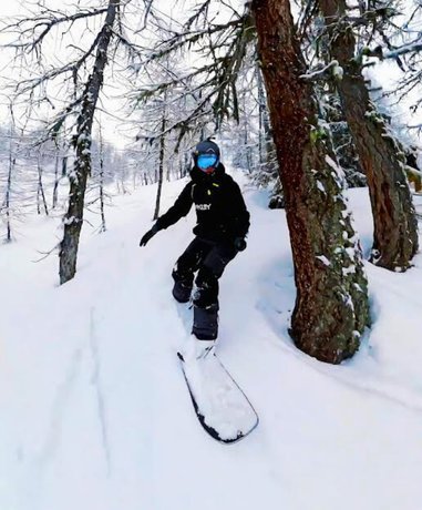 Snowboarder in action on a snowy mountain